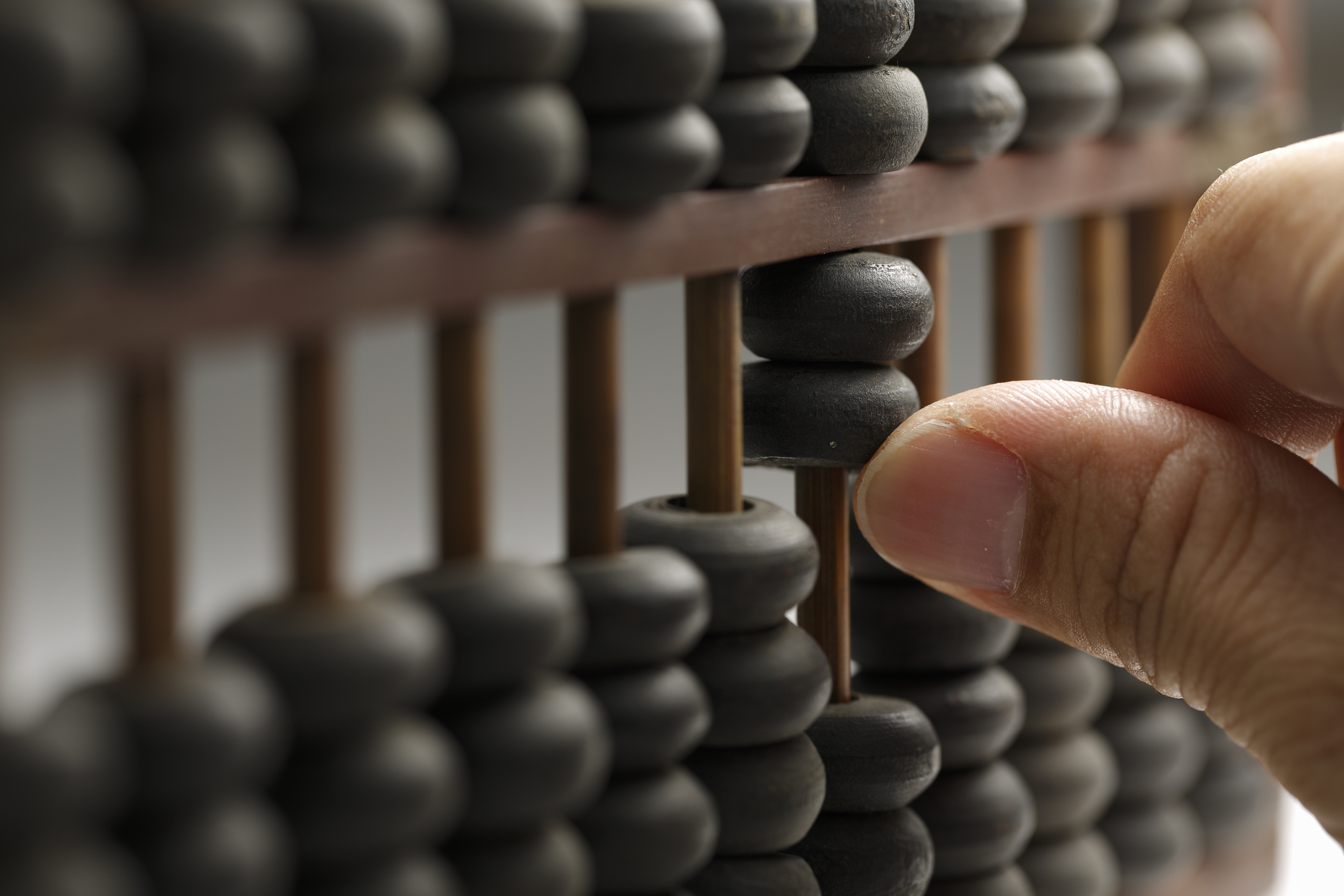 Photo of hand - calculation in abacus